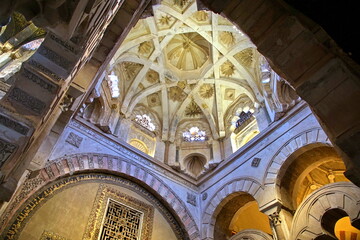 Fototapeta na wymiar Interior view of La Mezquita Cathedral in Cordoba Spain. The cathedral was built inside of the former Great Mosque. Popular tourist destination in Spain.