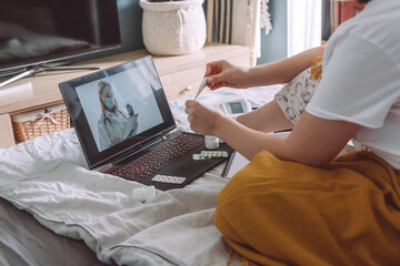 Fototapeta premium Online Medical insurance. telemedicine, telehealth,patient enters into a contract policy for medical care online, remotely. Medicine online in coronavirus covid 19, lockdown, quarantine.vaccination