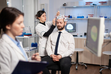 Man patient visiting professional medical researcher in neurology medicine testing brain functions...