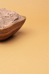 Close up. Bowl full of cocoa powder. Copy space.