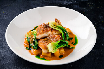 Snapper fish steak in white plate