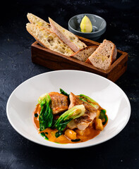 Snapper fish steak in white plate