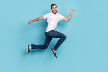 Fototapeta na wymiar Full length profile photo of satisfied person running toothy smile look camera isolated on blue color background