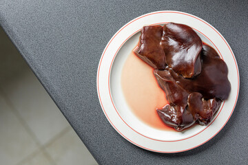 raw chicken livers on a plate, poultry liver