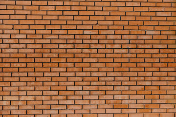 Wall made of red bricks background.