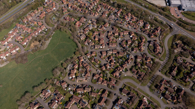 Aerial photo of the village of Caldecotte in Milton Keynes UK showing a typical British housing estate on a sunny summers day taken with a drone from above
