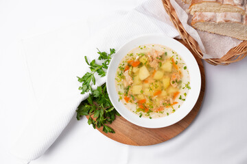 Ear soup in white plate on white background
