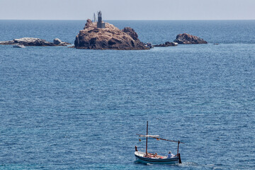 boat tourists on the costa brava on a sunny summer day