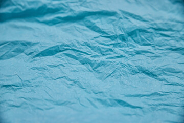 The texture of crumpled blue paper. Paper for wrapping gifts and flowers.