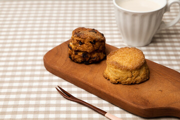 tasty scone with a cup of milk