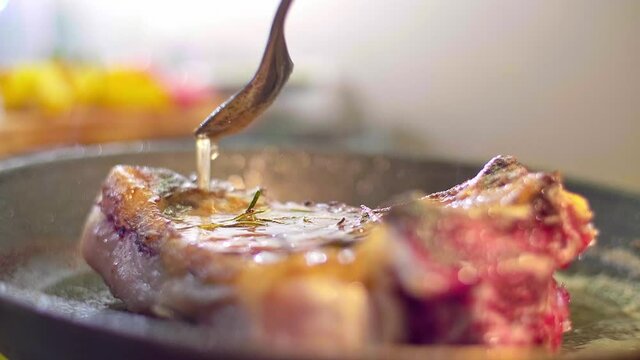 A close-up view of chef grilling meat