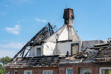 Fototapeta na wymiar Burnt down house roof exterior
