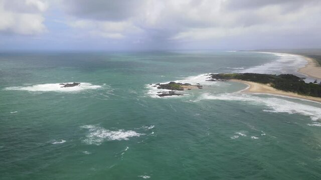 Scenic Overlook Of Bonville Headland At Beach Town Of Sawtell In New South Wales, Australia. aerial sideways