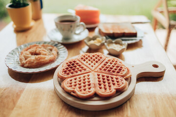 Fresh waffles on wood plate. Waffle and dessert concept.