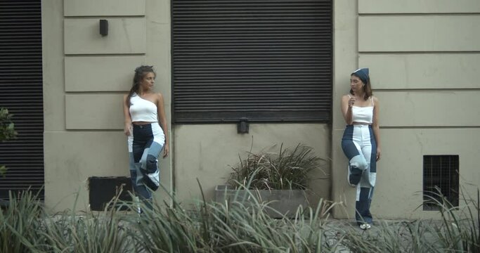 Artistic models acting symmetrically on a city wall