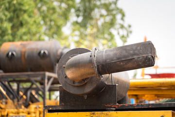 Wire mesh flame arrestor on  pumping power engine. exhausted piping. This is an equipment that used as safety device to prevent explosion due to flame sparking. Industrial object photo.
