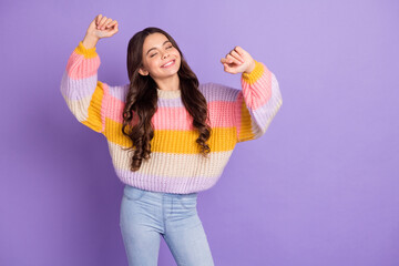 Photo of young cheerful girl happy positive smile have fun enjoy music dance isolated over purple color background