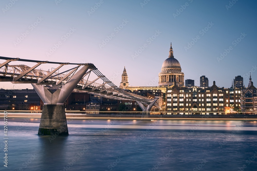 Wall mural London cityscape at dusk. City waterfront with 
Millennium Footbridge against St. Pauls Cathedral.