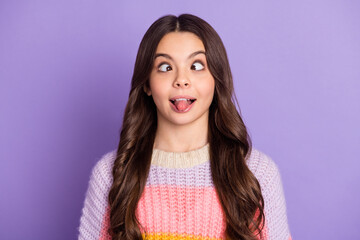 Photo of young preteen girl crazy grimace joke humor tongue-out isolated over purple color...