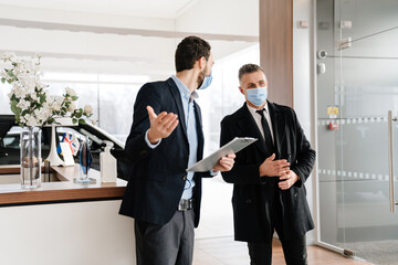 Salesman and customer in a car dealership