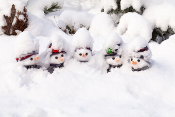 Five snowmen stick in a snow storm - 427660796