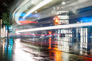 Night lights at shopping street Bahnhofstrasse with tram in Zurich, Switzerland