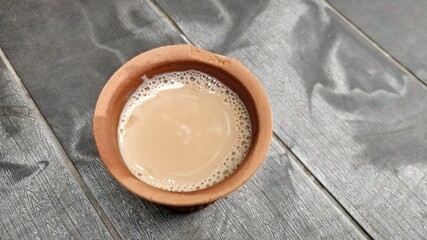 A kulhar or kulhad cup (traditional handle-less clay cup) from North India filled with hot Indian tea