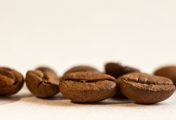 Roasted coffee beans, on a white background. Selective focus. Macro