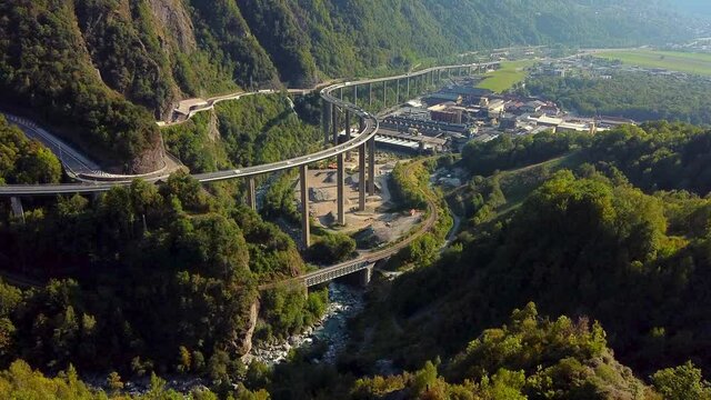 Aerial view of a huge and busy viaduct in the mountains. Viaduc des &Eacute;gratz de Passy, french Alps.
