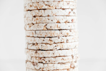 Round diet crispbreads on a white background. Round shaped cereal bread, healthy food without yeast. Copy, empty space for text