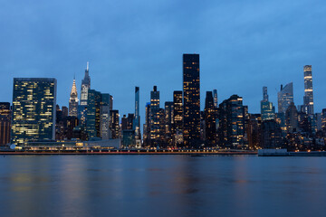 Fototapeta na wymiar Blue Evening Midtown Manhattan Skyline along the East River in New York City