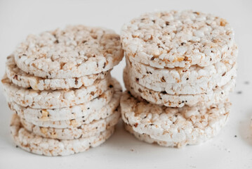 Round diet crispbreads on a white background. Round shaped cereal bread, healthy food without yeast. Copy, empty space for text