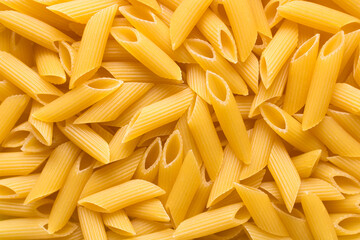 Raw Pasta Penne food background. Italian food. Top view.