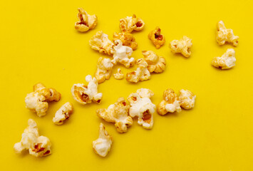 Close-up of popcorn on a yellow background.