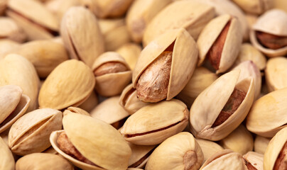 Close-up of fresh pistachio nuts as background.