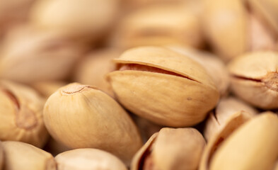 Close-up of fresh pistachio nuts as background.