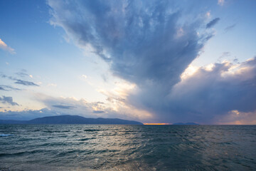 Fototapeta premium beautiful clouds with the setting sun over the sea