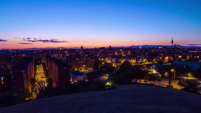 Panoramic day to night transition timelapse view of Madrid, Spain from the hills of Tio Pio Park, Vallecas-Neighborhood.