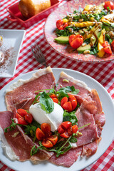 Fototapeta na wymiar Typical Italian salads on the restaurant table