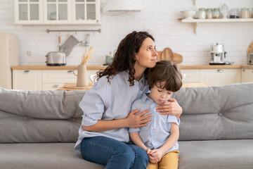 Caucasian mother feel sorry after fight and scold of preschool son hug him in comfort, love and...