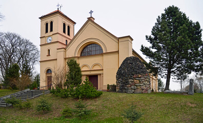 Fototapeta na wymiar A general view of the neoclassical Catholic church of St. of Saint Anthony of Padua in the town of Gąski in Masuria in Poland
