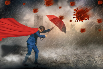 Superhero standing holding red umbrella protection,rain storm and virus,sky black cloud,virus outbreak epidemic coronavirus or covid 19,rainy season,concept insurance,health care and medical,vaccine