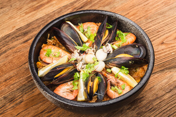 Tasty Spanish paella with seafood .