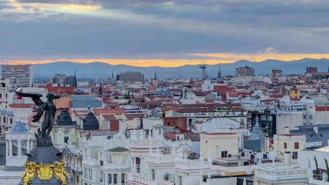 Panoramic aerial view of Gran Via timelapse before sunset, main shopping street in Madrid Skyline Old Town Cityscape, Metropolis Building, capital of Spain, Europe