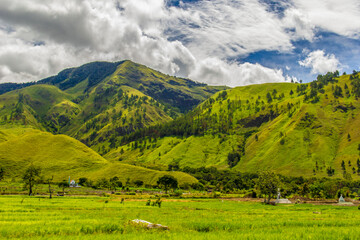 Fototapeta na wymiar Panorama of beautiful countryside of North Sumatera, Indonesia. Wonderful springtime landscape.