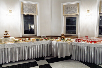 Buffet table for a holiday or corporate event. A large assortment of snacks. Buffet breakfast.