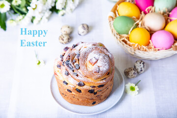 Craffin (Cruffin) with raisins and candied fruits. Easter cake Kulich and painted eggs. Easter Holiday. Close-up.