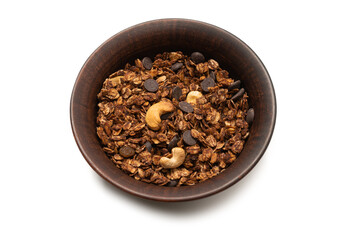 Chocolate granola cereal with nuts in a bowl background.