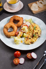 Donuts and egg served for breakfast on a table