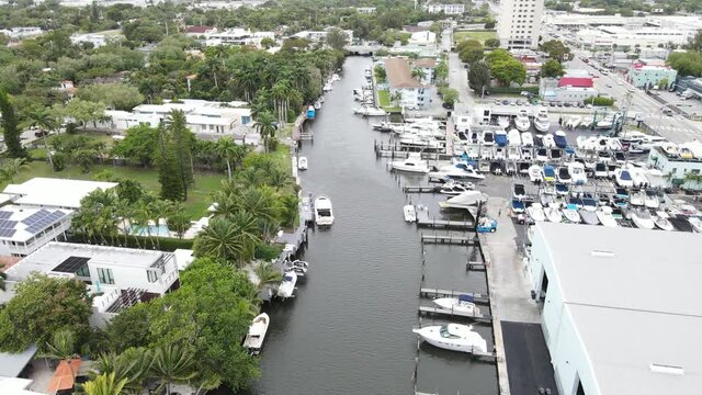 Luxury residences on Little River, Miami, Florida next to a boat yard